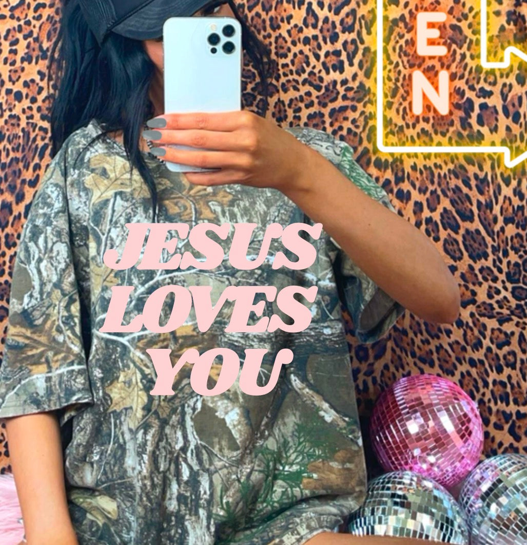 JESUS LOVES YOU CAMO TEE – FRINGED OUTLAW WHOLESALE, image size:1027x1061